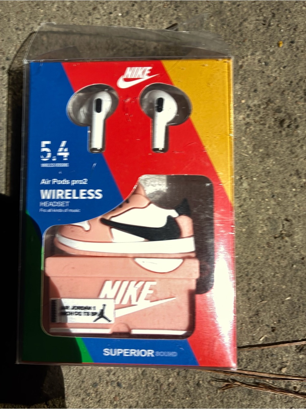 Nike Wireless Earbuds with White Earphones and Pink Charging Case